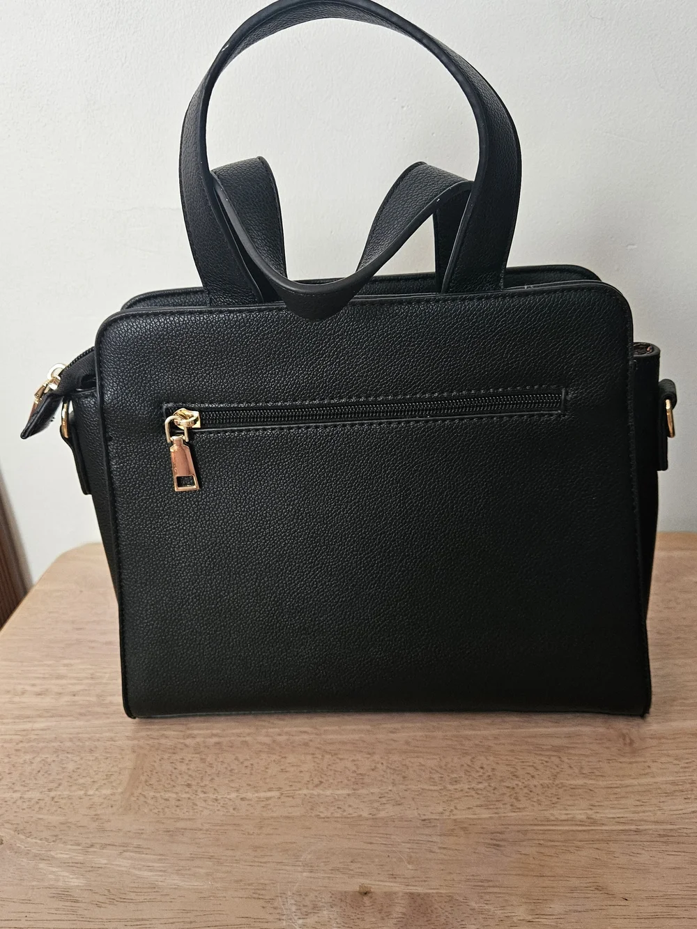 Black Structured Women's Handbag with Detachable Strap.